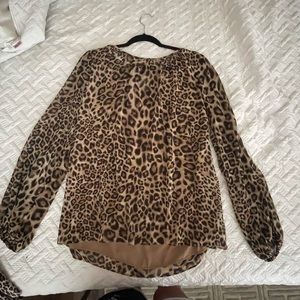 White House Black market animal print blouse. Never worn.